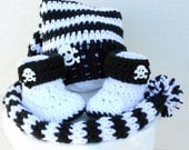 Crocheted baby pixie hat and booties black and white skull Halloween set.