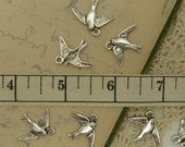 10 antiuqe silver tone swallow / flying bird charms  size 22 mm by 18 mm