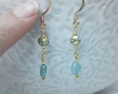 delicate, simple gold and aquamarine earrings