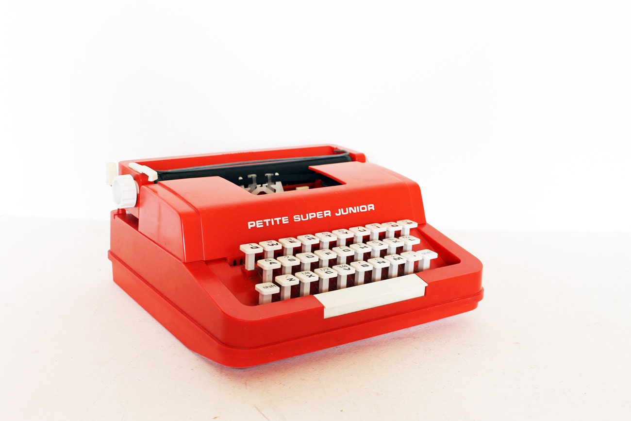 Vintage red typewriter by Byron Jardine Limited