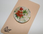 Button, cream coloured with orange flower chintz design