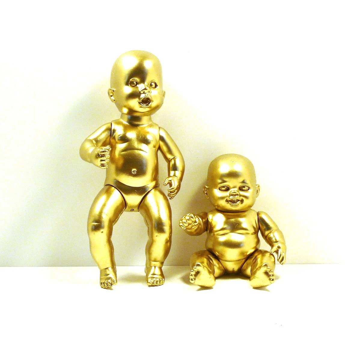 pop art dolls, metallic gold, baby doll, weird home decor, avant garde, strange, obscure, photo prop, spray painted, graffiti
