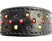 Black leather cuff bracelet with red, yellow and orange glass bead inlay