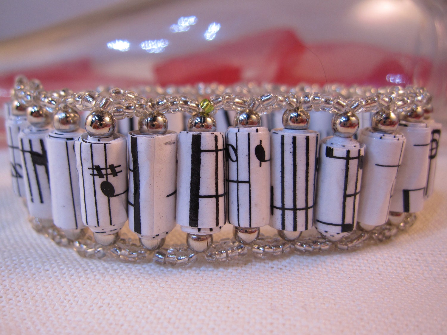 Bracelet made with beads crafted from sheet music