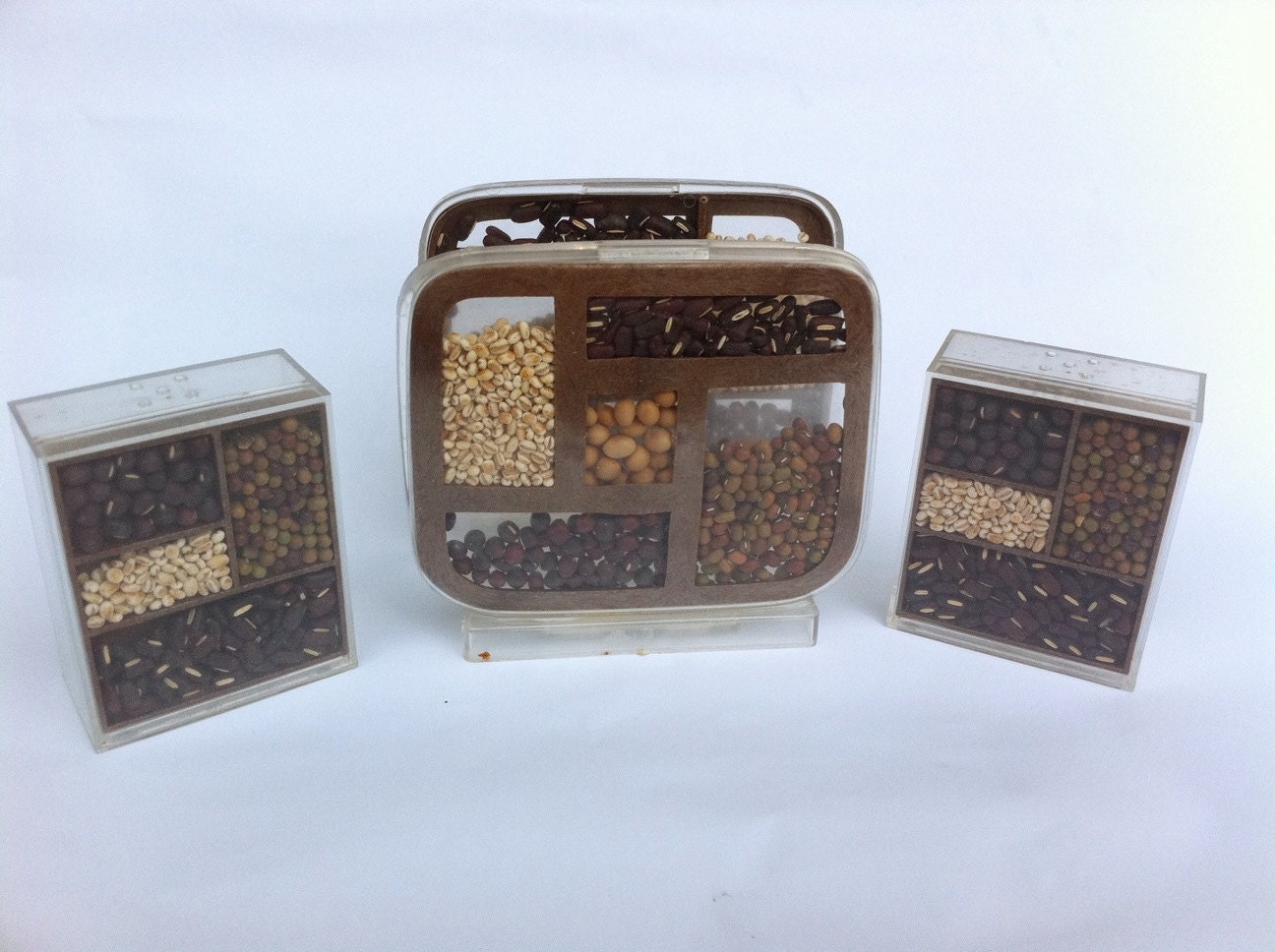 Vintage acryllic salt and pepper shakers and napkin holder.  Victor Goldman.  Brown beans and grains.