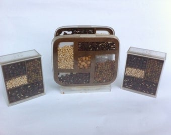 Vintage acryllic salt and pepper shakers and napkin holder.  Victor Goldman.  Brown beans and grains.