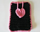 Crocheted phone cover in black with a pale pink heart and trim