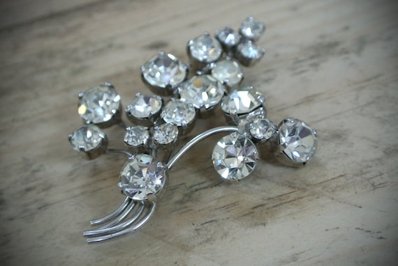 Silver Diamond-like botanical brooch featured image