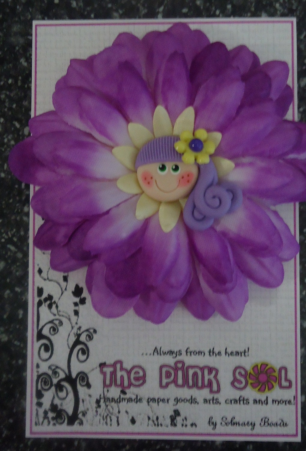 Violet flower hair clip - With beautiful handmade cold porcelain doll face center.