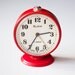 Vintage red mechanical alarm clock "Slava"