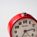 Vintage red mechanical alarm clock "Slava"