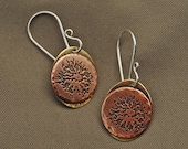Earrings E285 - etched copper sun faces soldered to brass ovals
