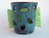 Ceramic sponge holder: mottled teal pottery cup with falling leaf cutouts