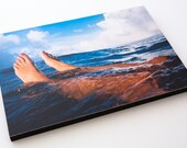 Painted toe nails swimming in the sea.  9" by 6" Wooden block mounted Lomo Photograph. Shot on Film.