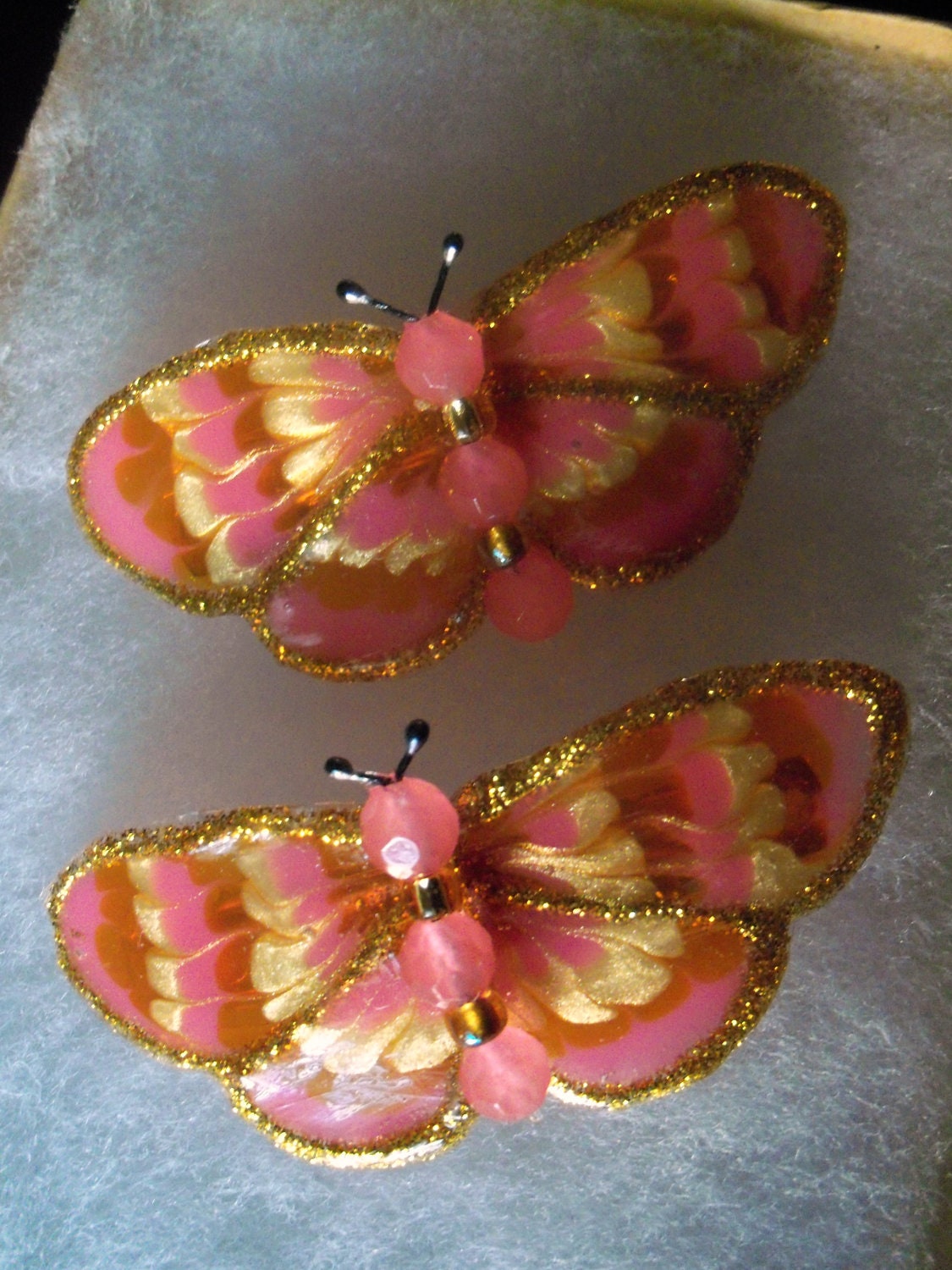 pair of small pink butterfly barrettes