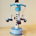 Blue and white carnival ride with sailors, retro collectible toy