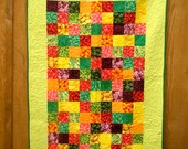 A "well-balanced diet" twin-sized pieced quilt with veggies fabrics