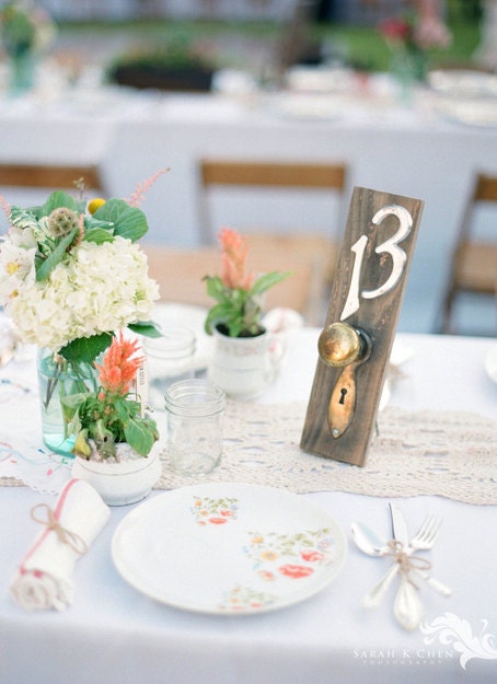 table numbers: vintage door plates and door knobs