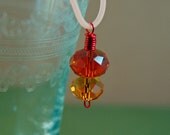 Shades of Orange Crystal Pendant on Rubber Cord