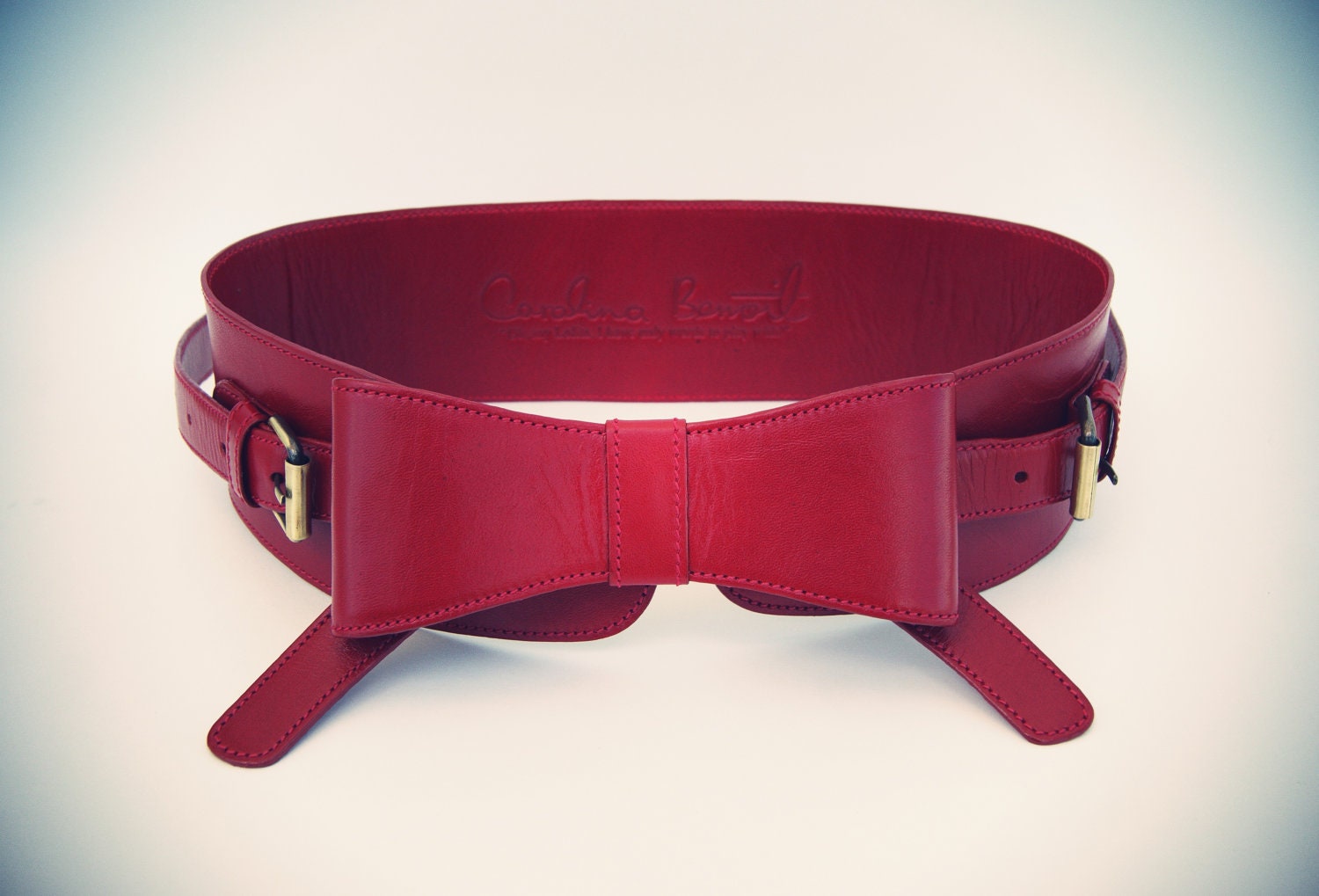 Red Leather Waist Belt With Bow At The Front And Gold Buckles