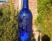 Repurposed / recycled cobalt blue wine bottle lantern etched with grapes, vines and leaves