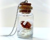 Ice Age inspired bottle necklace, winter wonderland scene with a mammoth on a glacier