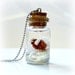 Ice Age inspired bottle necklace, winter wonderland scene with a mammoth on a glacier
