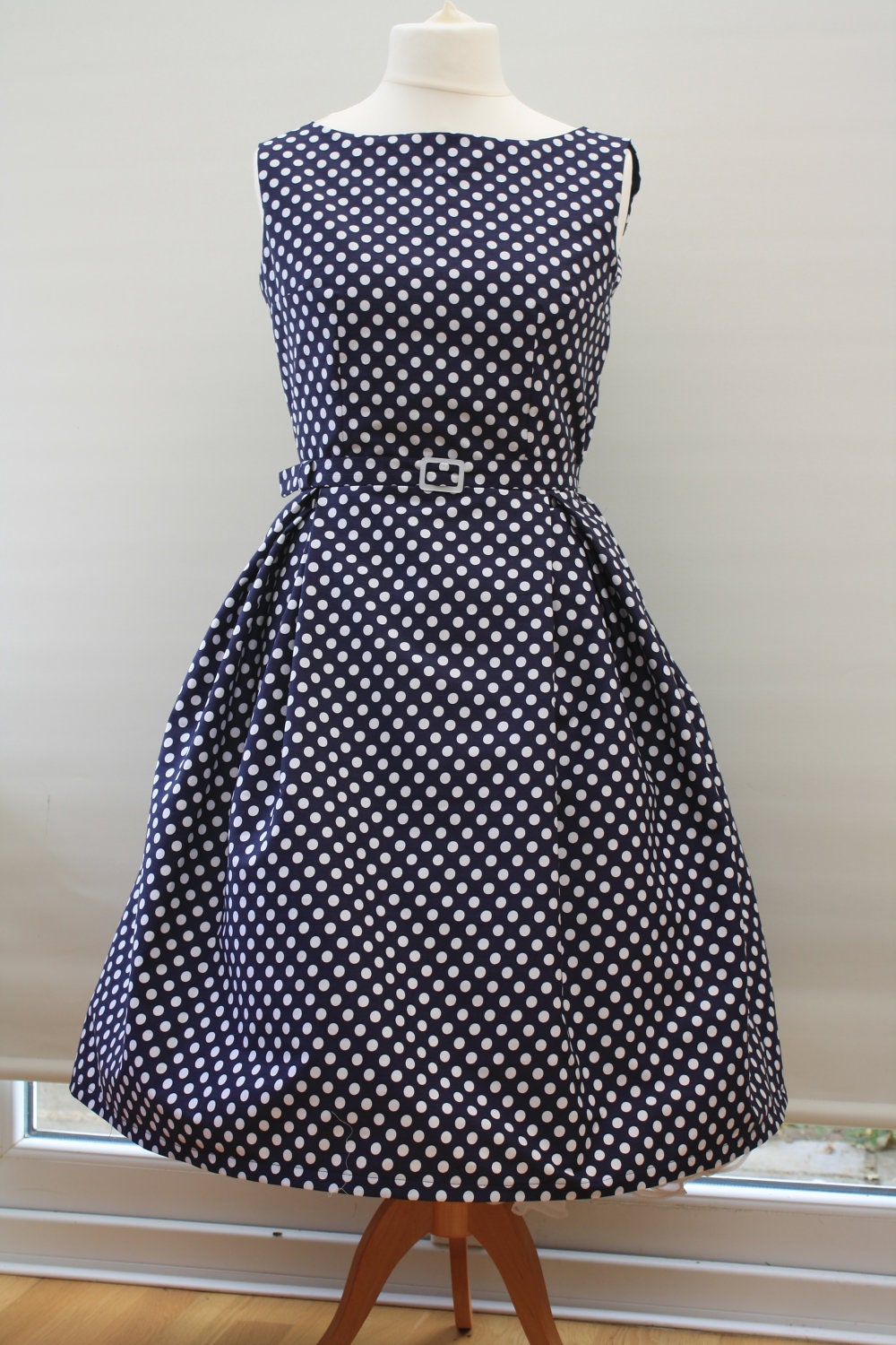 1950s style navy blue and white polka dot dress