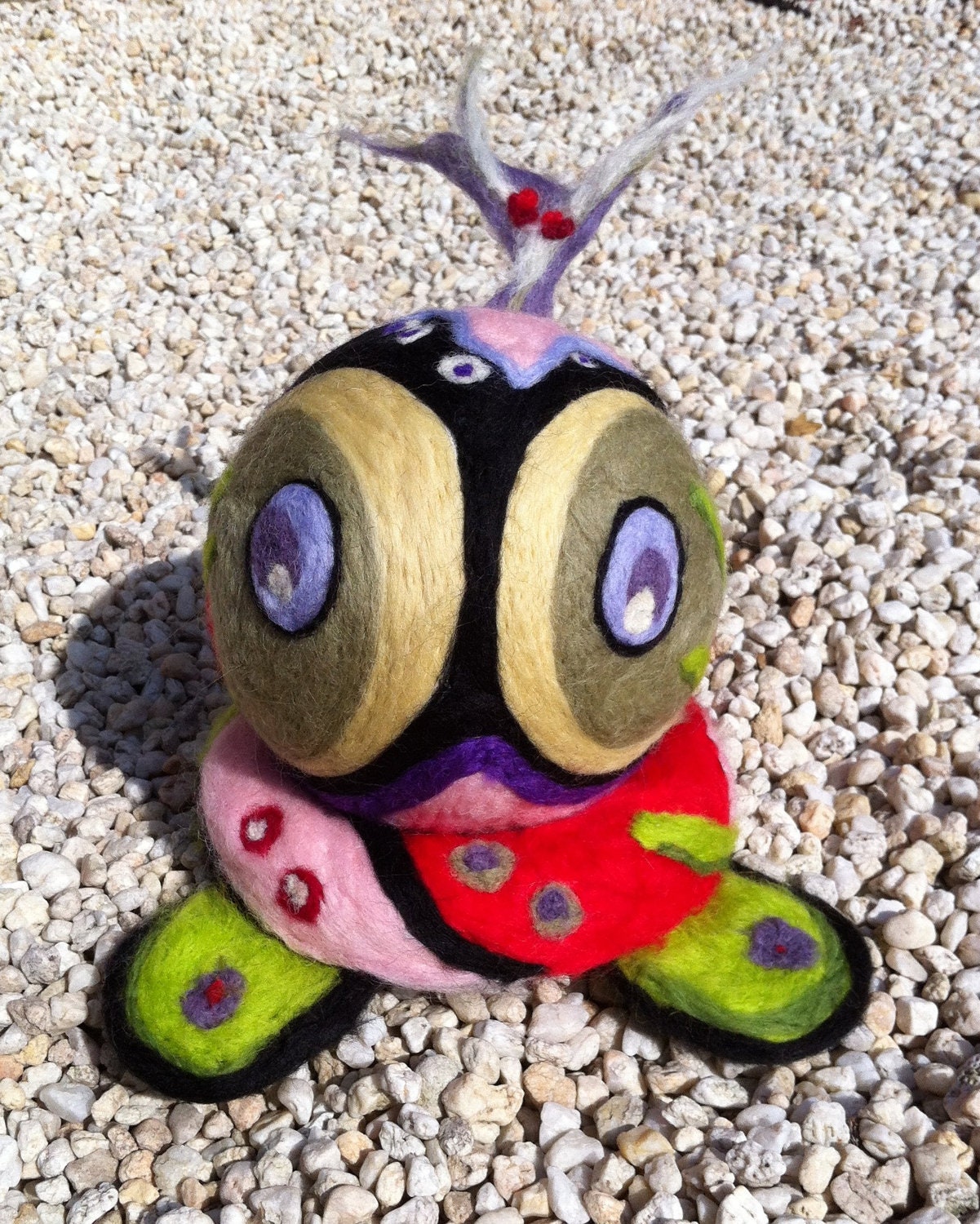 Hand felted sculpture with lots of colors