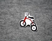 Red toddler tricycle, brooch