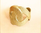 Infinity Cuff made from reclaimed brass