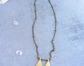 Long chain gold necklace vintage inspired with a pentagonal handmade brass charm.