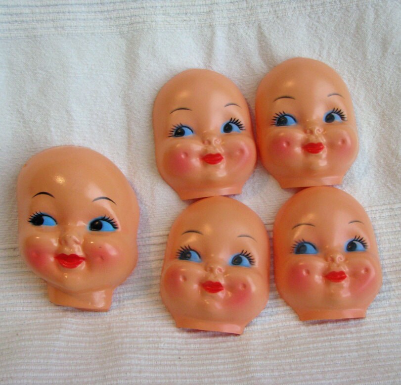 sweet plastic doll faces by jupiterdesigns on Etsy