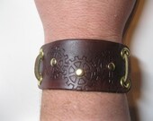Steampunk leather bracelet / cuff with stamped gears