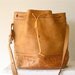 tooled leather southwest bucket bag in camel tan