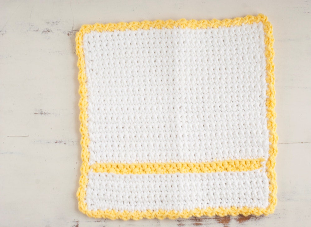 Crochet cloth dish cloth in white cotton with yellow stripe