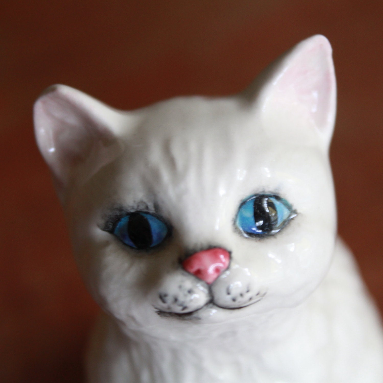 white ceramic cat figurine