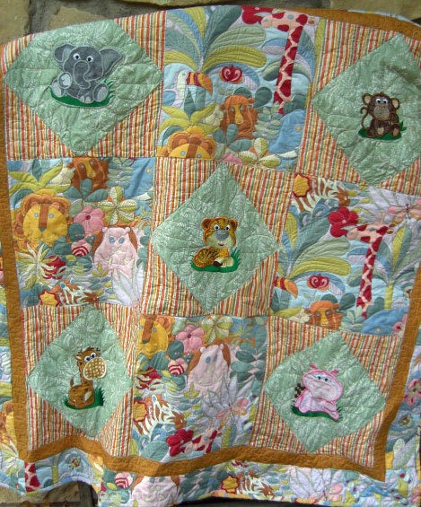 Machine appliqued jungle animals on baby/toddler quilt