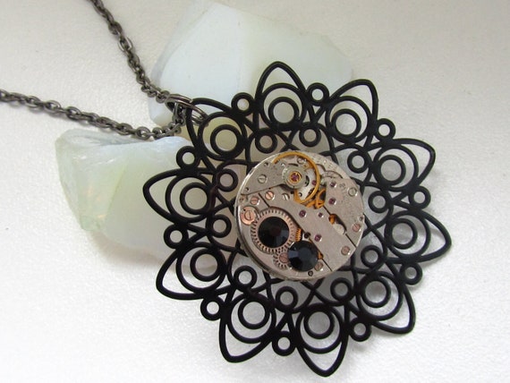Steampunk Gothic filigree  flower necklace - with small vintage watch movement and 2 jet black Swarovski crystals. Gift under 30 Dollars