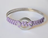 Purple suede bangle. Suede hand wrapped around two silver bangles with vintage nuts & bolts tribal piece