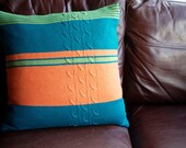 Knitted pure wool cushion cover with stripes and cables