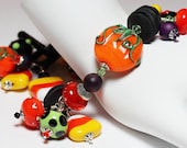 Handmade Jewelry Bracelet Beaded Lampwork Crystal Cha Cha Halloween Orange Black Green Purple Silver Pumpkin Candy Corn...Practical Magic