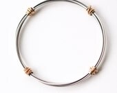 Ultra modern oxidized silver and solid 14KY gold bracelet, pairing of the dark of the silver and yellow gold - "Gold Bundle Hoop Bracelet"