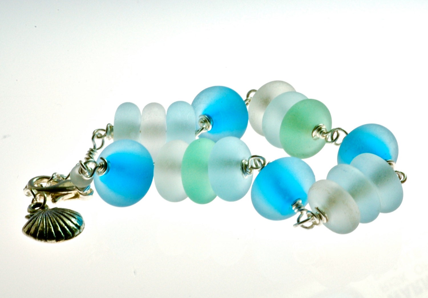 Handmade lampwork seaglass style glass and silver bracelet in water blues by Paulbead