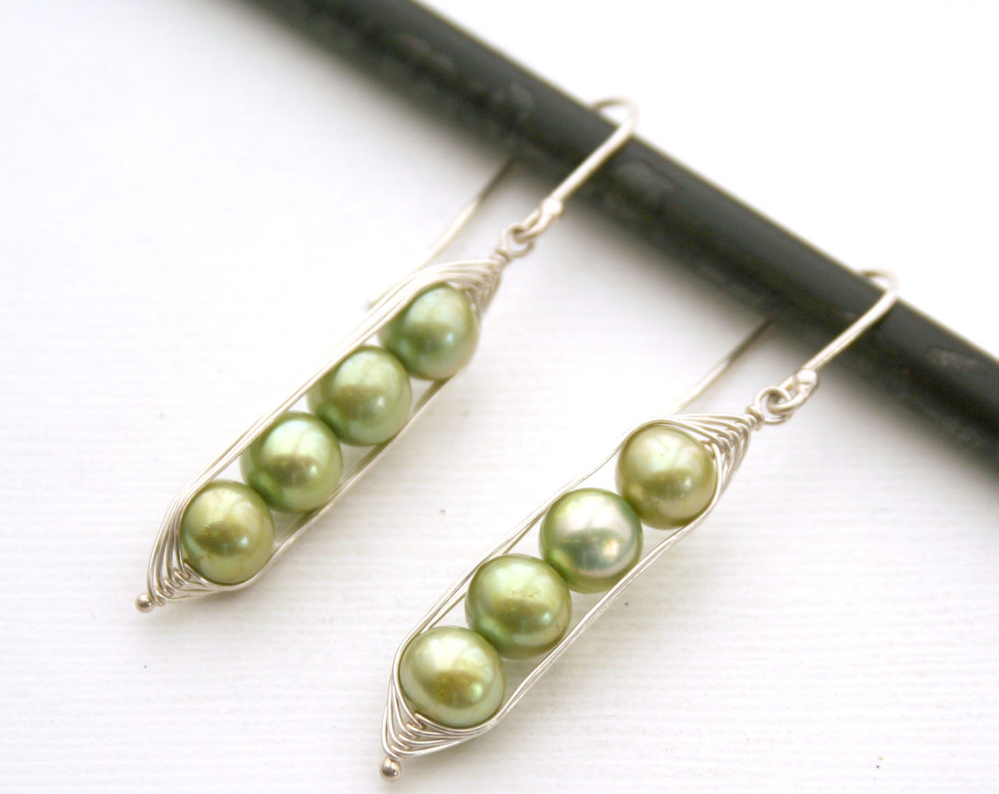 Peapod earrings. Four peas in a pod with green fresh water pearl.