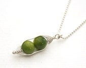 Peapod necklace. Two peas in a pod, green mother of pearl pendant on sterling silver chain.