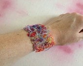 Sterling Silver crochet bracelet with multicolor fiber fabric