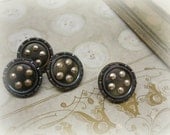 matching set of 4 antique celluloid and cut steels buttons .