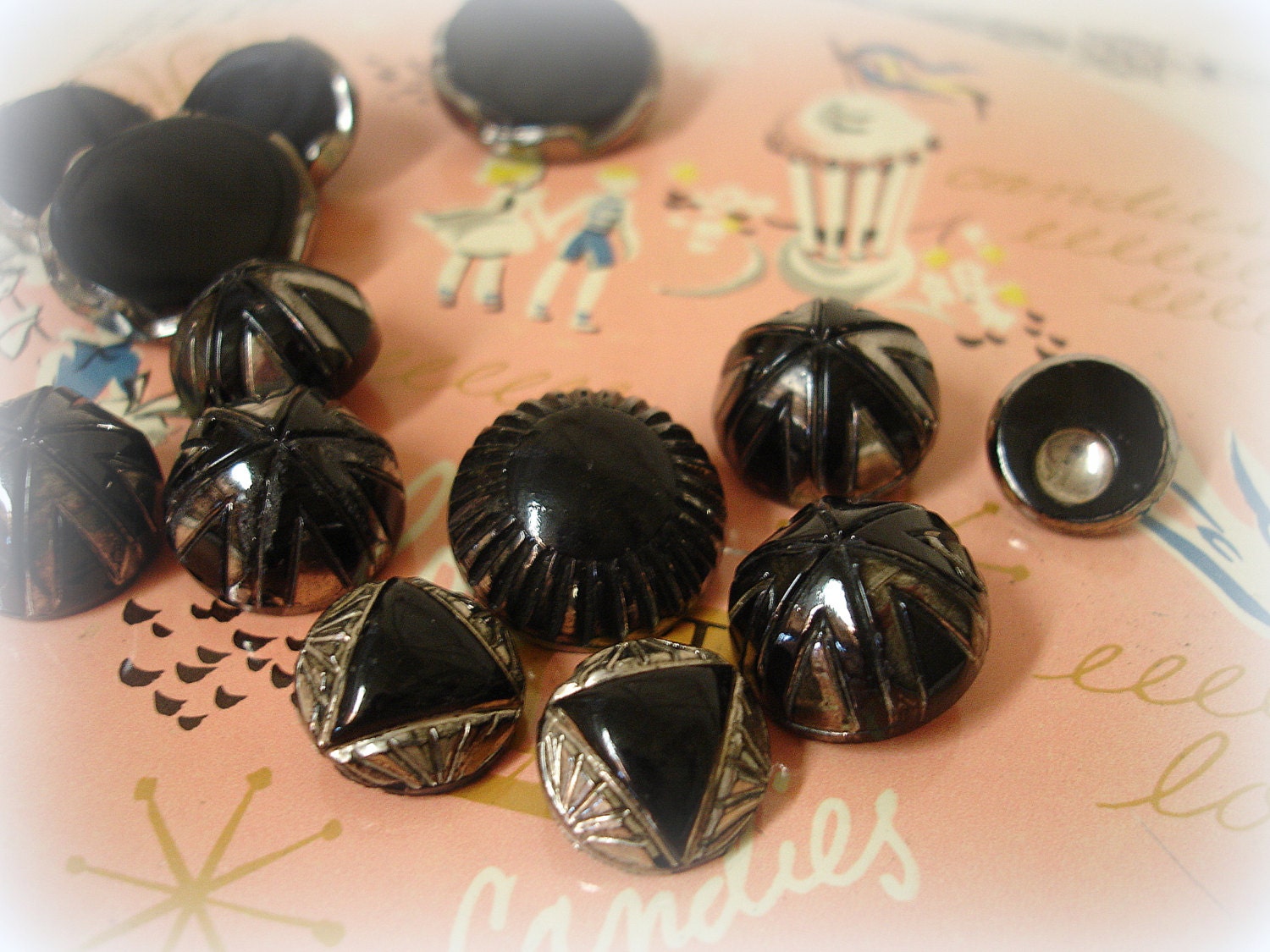 assorted deco era jet buttons with luster . a dozen beauties jet black glass with silver luster shank buttons