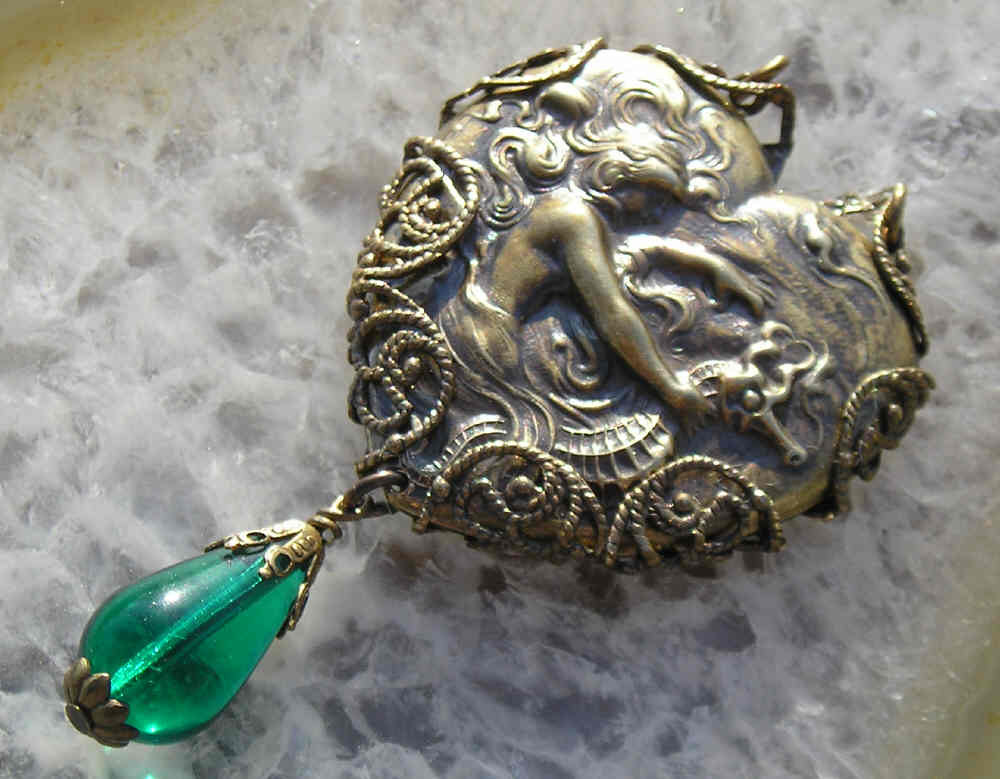 Ride, Mermaid,ride..vintage brass heart mermaid pendant wrapped in filigree